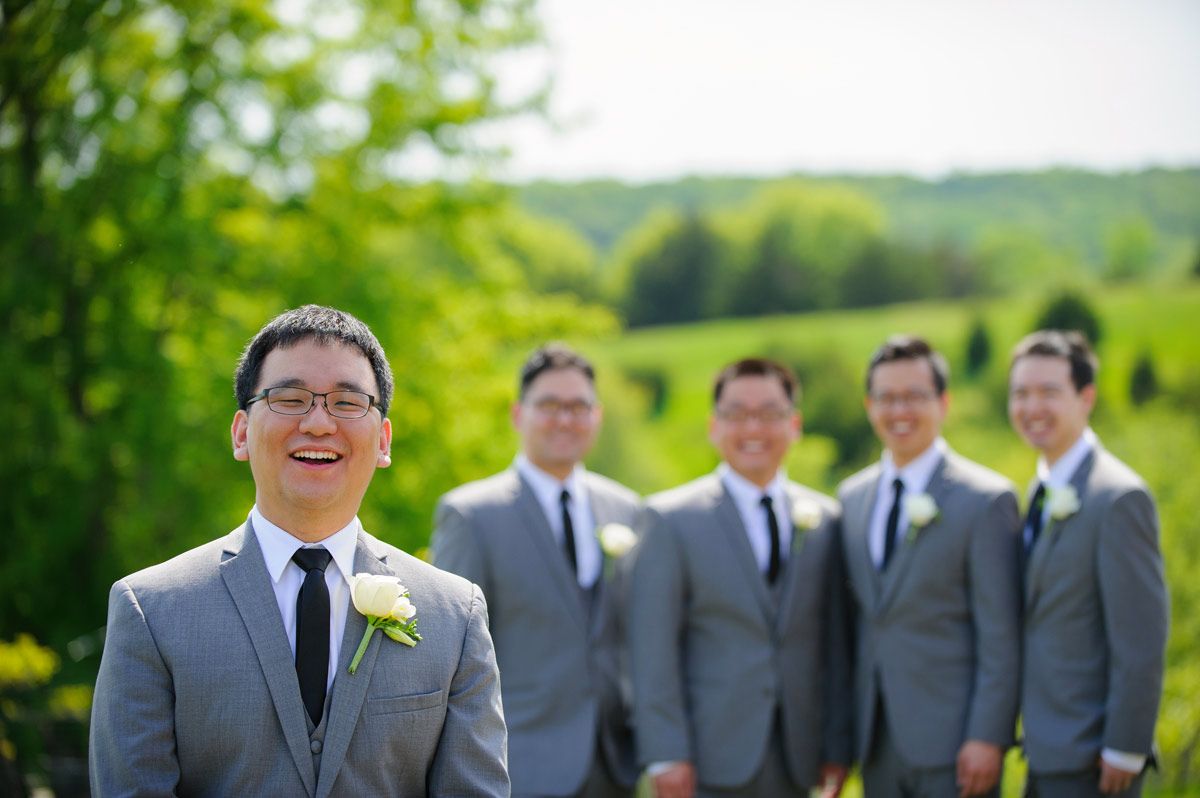 Photo of the groom with his groomsmen in the background